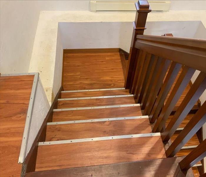 Stairs are heavily damaged with water damage and mold.